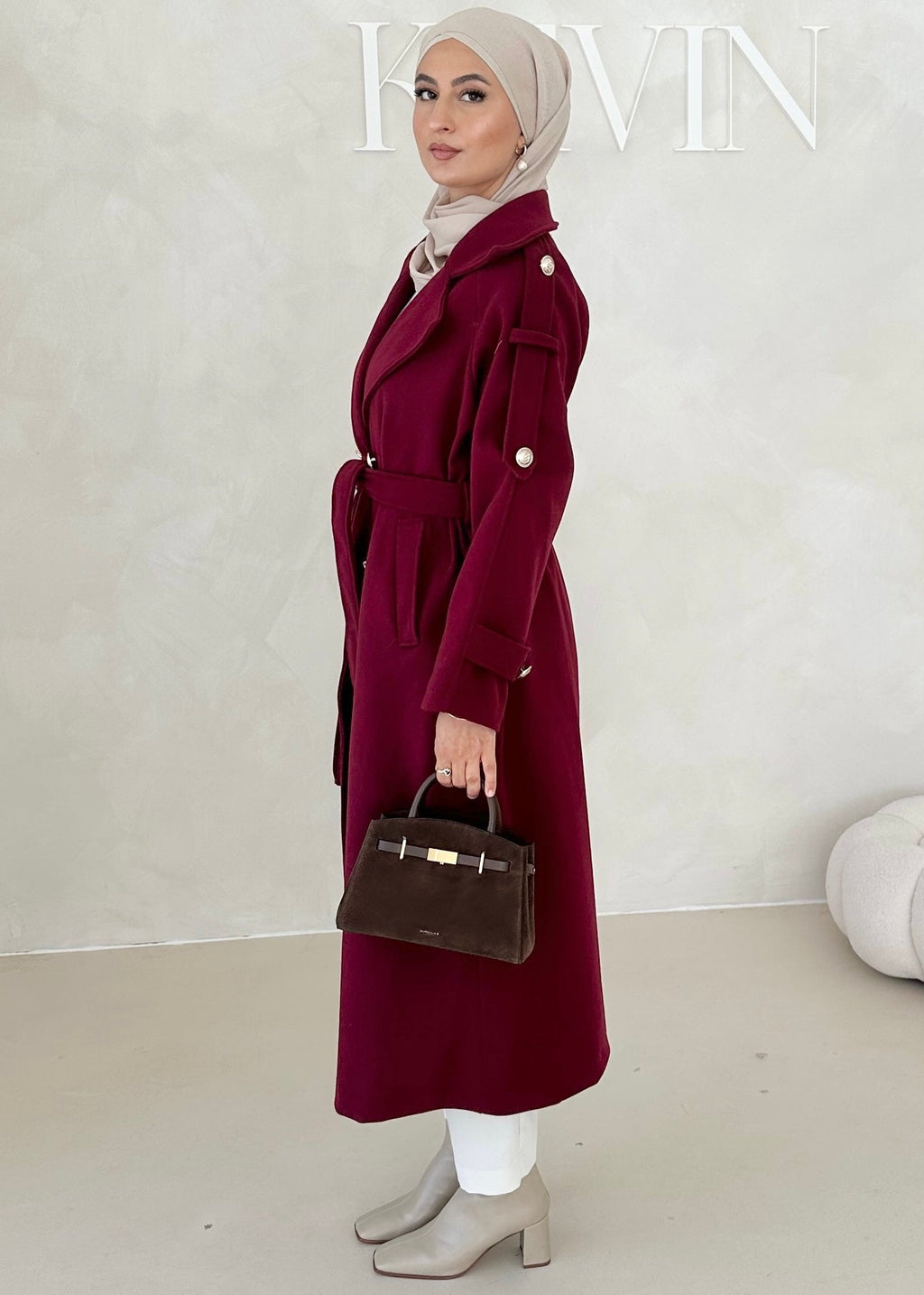 Manteau avec boutons dorés